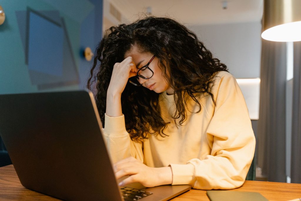 tired freelancer working home desk